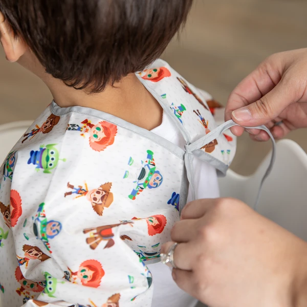 Bumkins Sleeved Bib – Toy Story (6-24 Months)